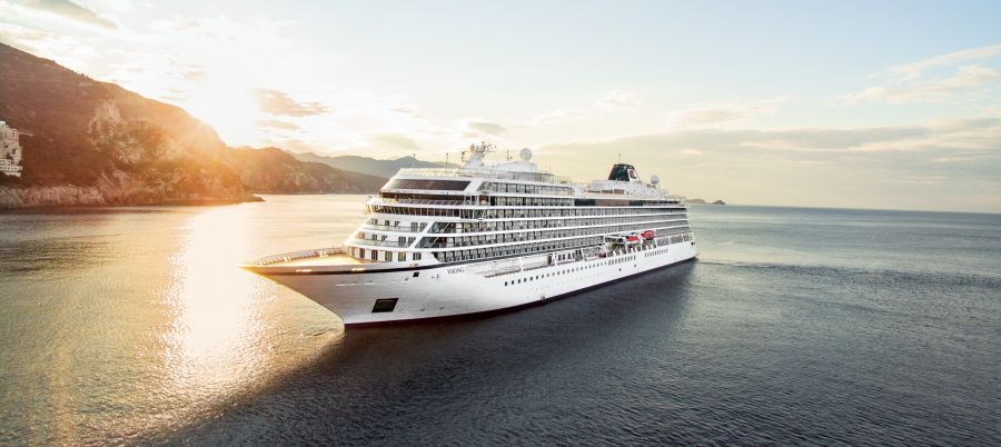 <who>Photo credit: Viking</who>A Viking cruise ship departs Dubrovnik at sunset.